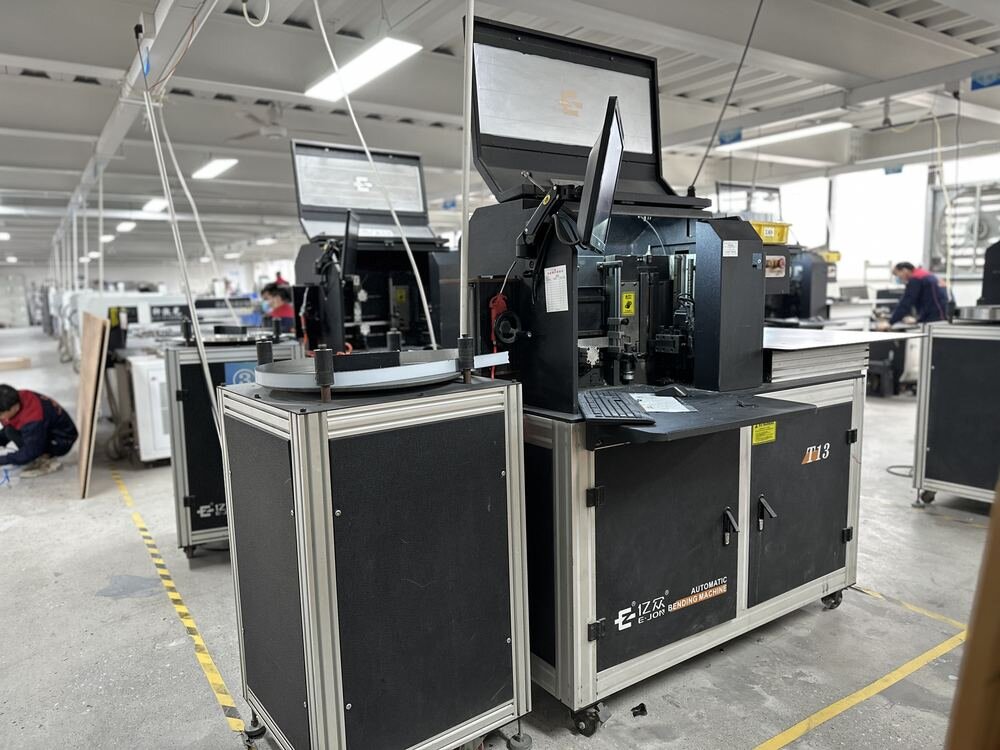 Automatic channel letter bending machine in production workshop, CNC fabrication equipment