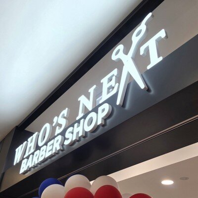 White front-lit channel letters at barber shop mall storefront