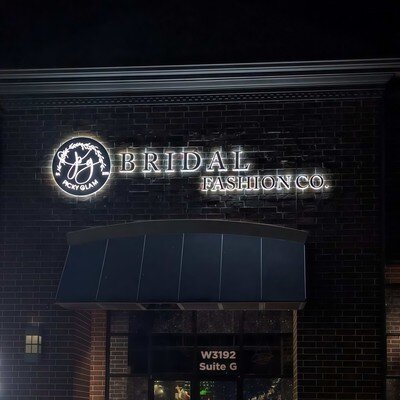 Halo-lit channel letters on brick exterior at night, customer installation