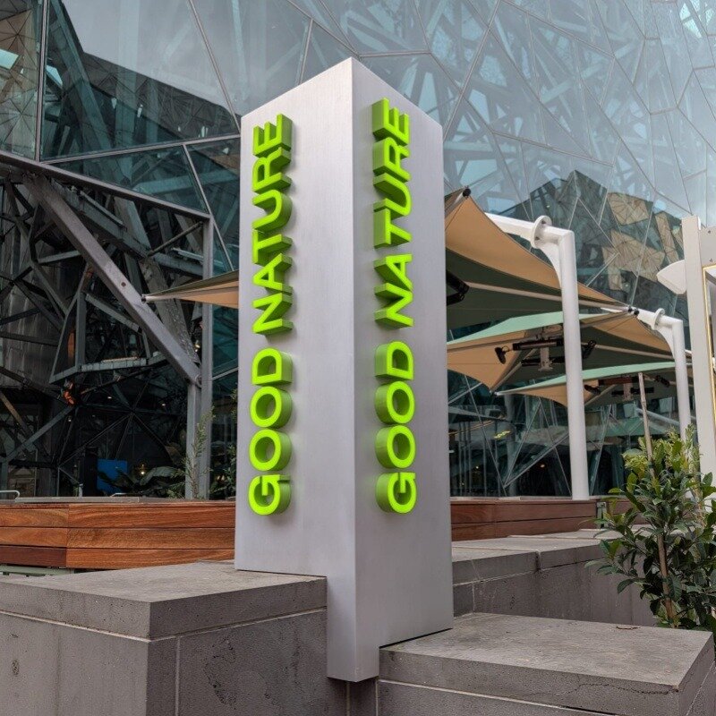 Green 3D channel letters on outdoor pillar at public space, Australia customer installation