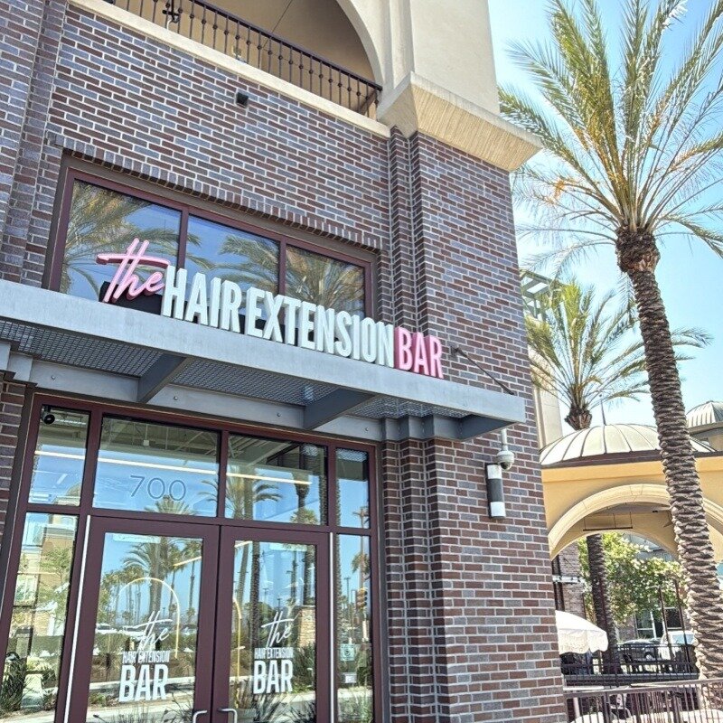 Front-lit channel letters on brick retail storefront, USA customer installation
