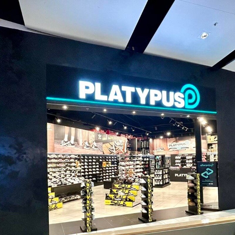 White front-lit channel letters at retail shoe store mall, USA customer installation